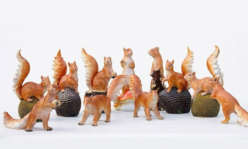 Realistic Squirrel Sculptures with Acorns and Pinecones